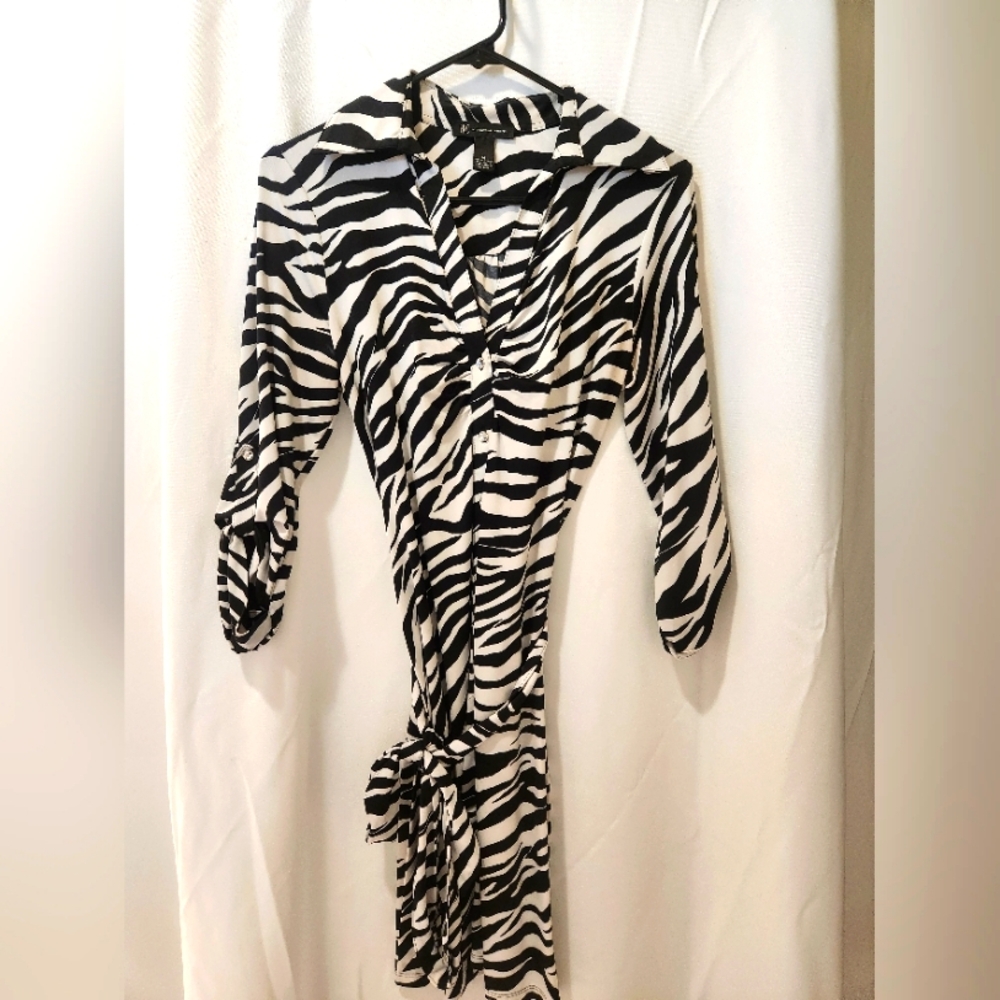 Black and white animal print dress with pearlized buttons and belt wrap